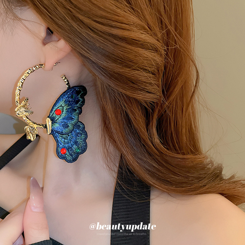 Pendientes de mariposa azul con bordado de aguja de plata Pendientes de estilo antiguo de personalidad europea y americana Pendientes de lujo ligero exquisito de alta calidad