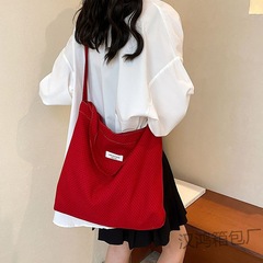 韓国版ファッションカジュアル大容量トートバッグ女性2024夏の新型通勤キャンバスバッグシンプルなシングルショルダーバッグ
