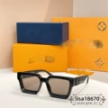 Black frame light brown lenses black logo