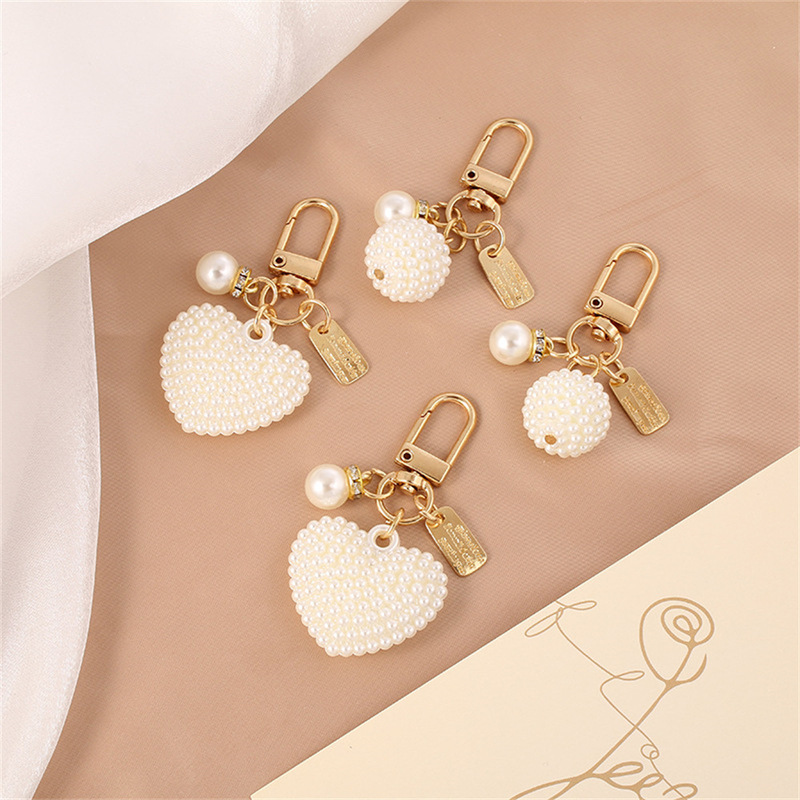 New Pearl Alloy Keychain Pendant Creative Pearl Hollow Love Accessories Bluetooth Headphone Box Bag Pendant