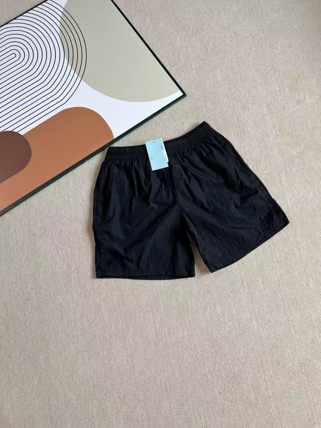 2025 verano nuevo co-marcado para hombres y mujeres transfronterizos pantalones cortos deportivos de tejido 8194