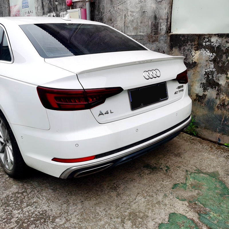 Suitable for Audi A4L, this S4-style small rear spoiler is a paint-applied ABS rear diffuser that can be installed without drilling holes, providing a streamlined and aerodynamic look