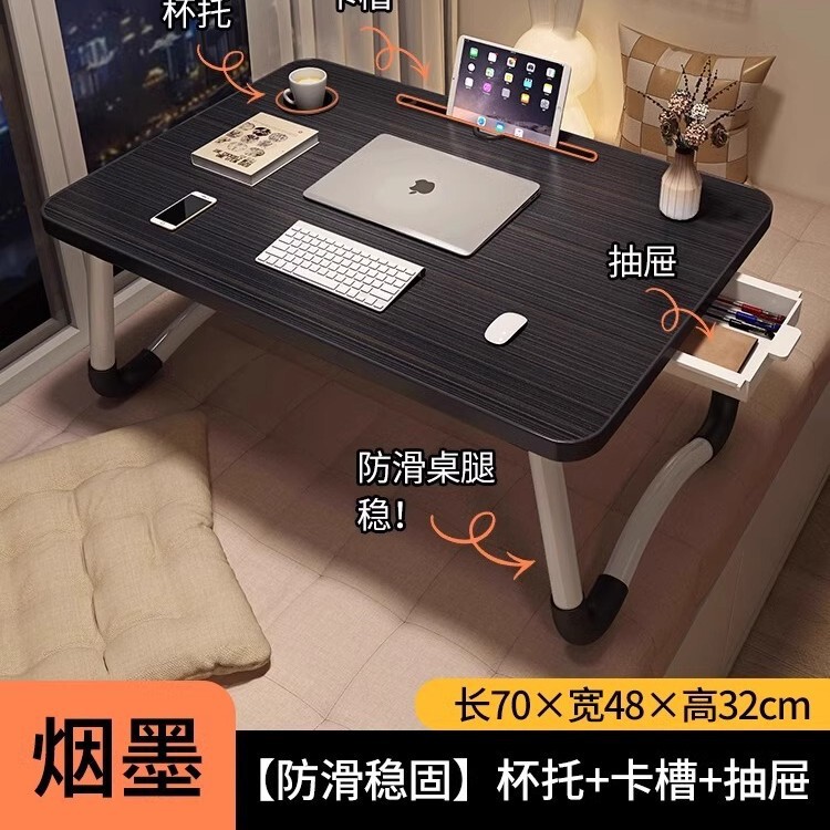 折り畳み可能なベッドの上の小さなテーブルは机のノートパソコンのテーブルを勉強します。|undefined