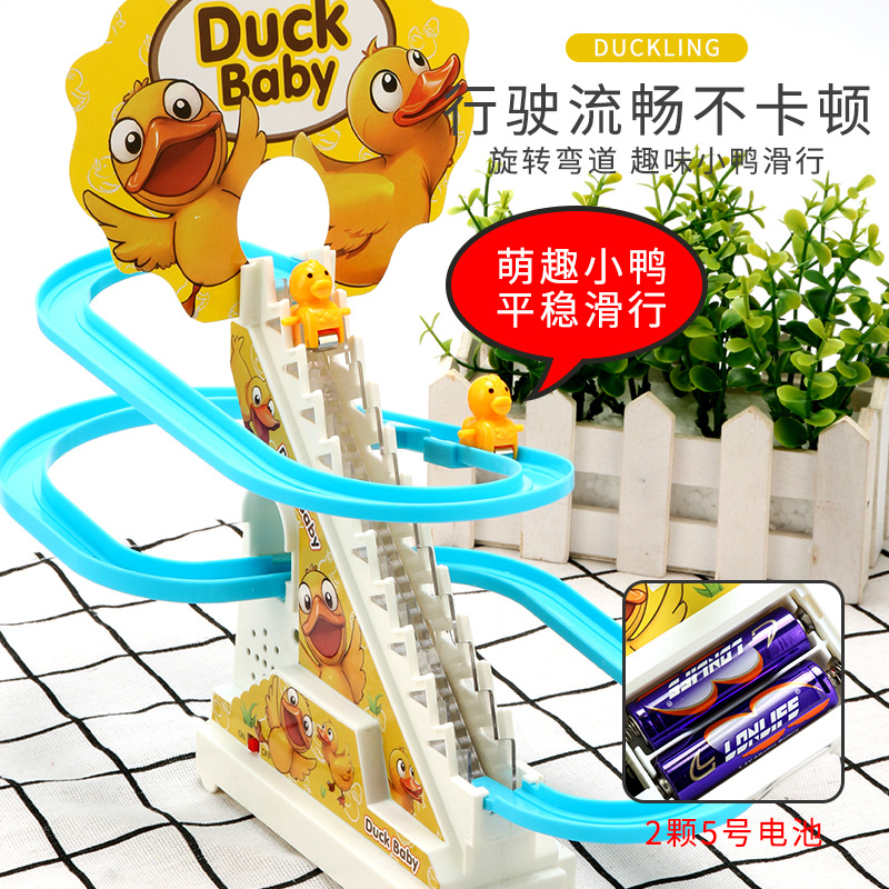 El mismo pato escalera pista de rompecabezas pequeño pato deslizante diapositivas música luces juguetes para niños al por mayor