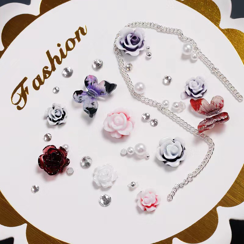 Manicure camellia material paquete de joyería pequeño libro rojo explosión arco mezcla de cadena de joyería de uñas accesorios al por mayor