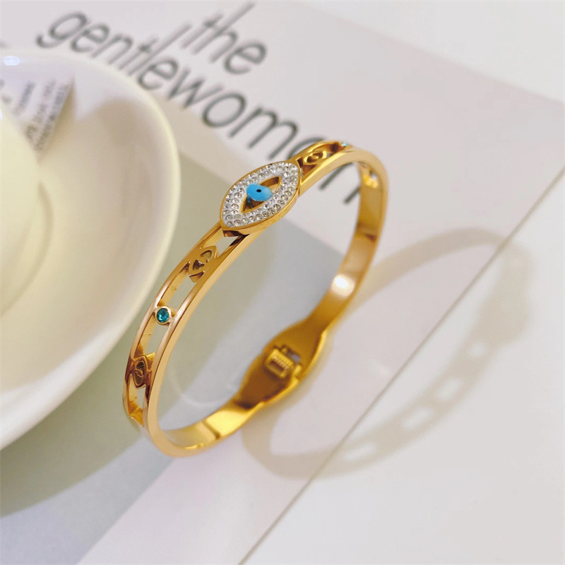 Fashion Hollowed Devil's Eye Shaped Inlaid Zircon Titanium Steel Bangles Wholesale display picture 5