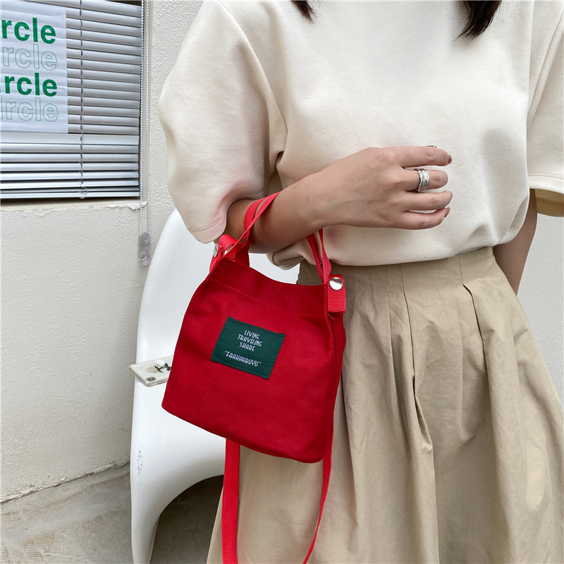 Bolso de mujer nuevo estilo coreano simple bolso de lienzo de chicas fresco de color sólido bolso de cubo de moda moda bolsa de mochila casual