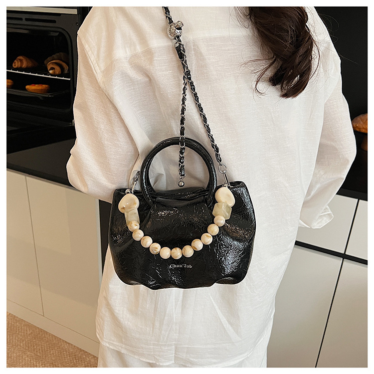 A stylish and trendy beaded bag for women, a new summer chain crossbody cloud bag for women in 2025 undefined