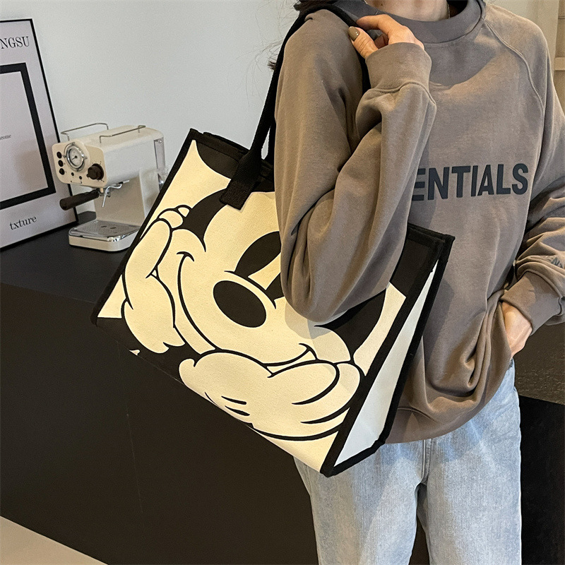 2024 bolsa de lona de las mujeres de primavera nueva moda bolsa de hombro de gran capacidad bolsa de viaje portátil de dibujos animados bolso de la momia