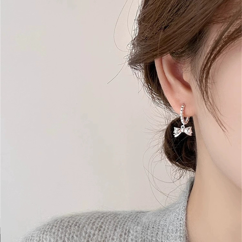 Three dimensional small design earrings with bow, 925 sample silver, light luxury style, high-quality style