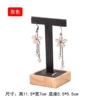T -shaped earrings are dark gray