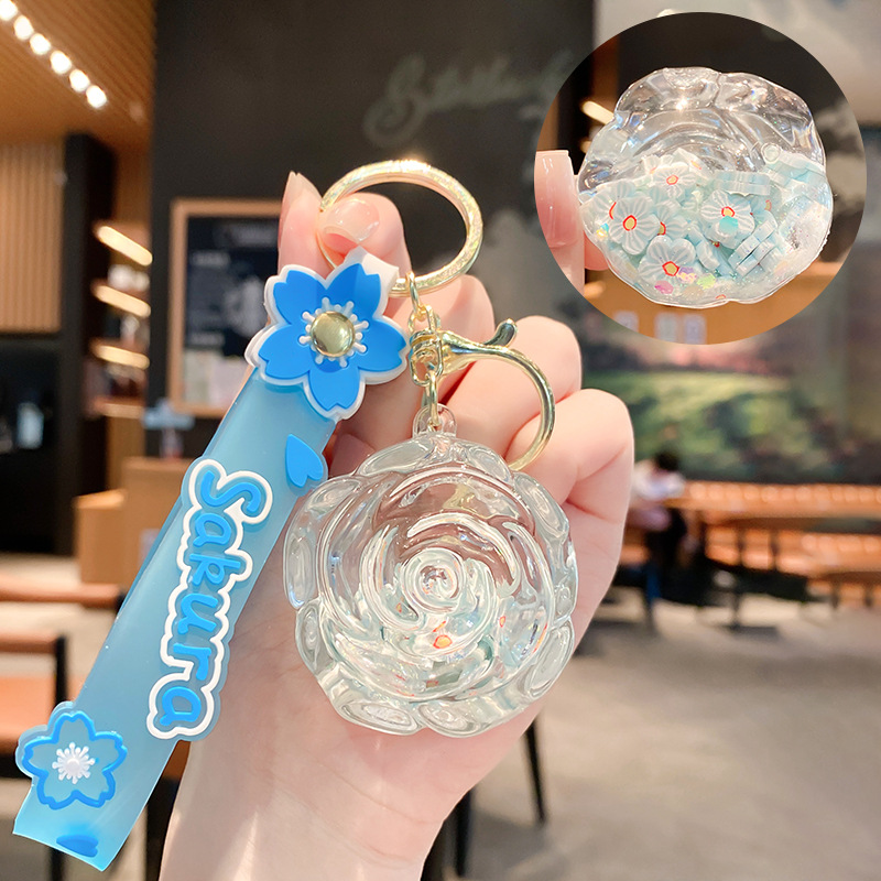 Llavero de rosa de aceite creativo lindo líquido arenas movedizas colgantes pequeños bolsos accesorios pareja pequeños regalos al por mayor