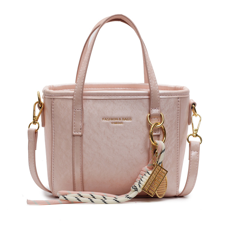 Bolso de cubo de comercio exterior para mujer sentido de alta gama 2025 nuevo bolso de hombro de viajero de todo fósforo bolso de mensajero de moda casual simple
