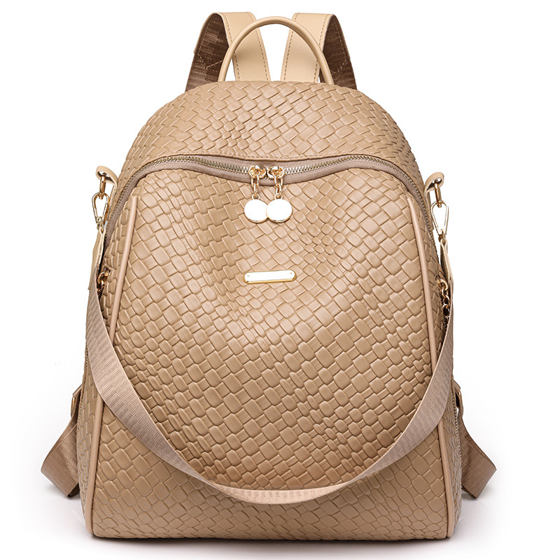 2024 exportación nueva mochila de cuero suave tejida para mujer moda y simple mochila de viaje al aire libre de doble uso marea