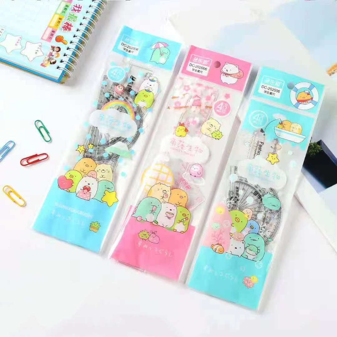 Venta al por mayor patrón de dibujos animados triángulo regla traje creativo escuela primaria estudiante 4 piezas combinación traje aprendizaje papelería recompensa regalo