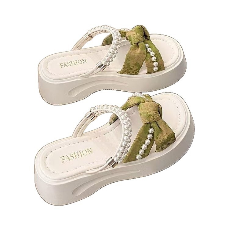 Zapatillas de estilo nacional de perlas para mujeres de verano 2026 nuevo estilo de hadas con falda no cansarse pies zapatillas frías damas