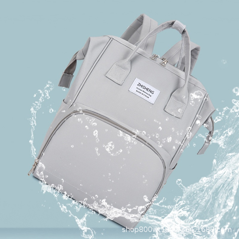 Transfronterizo nuevo bolso de mamá multifuncional portátil de mano ligero bolso de hombro madre-bebé de gran capacidad madre fuera mochila al por mayor