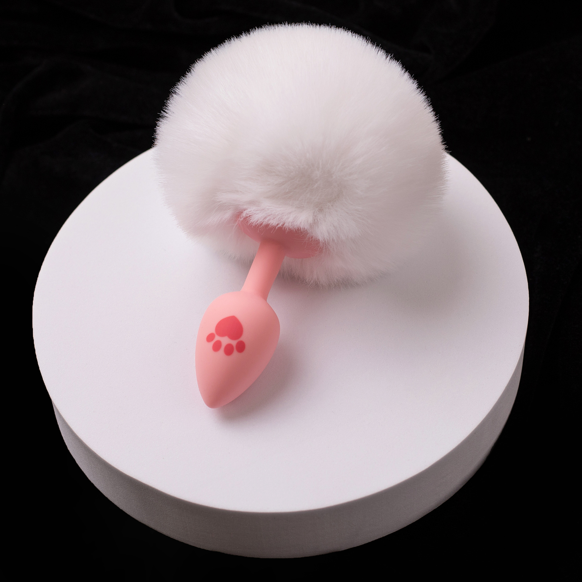 White cat paw fur ball