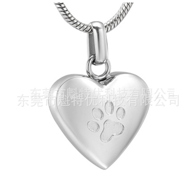 Japonés y coreano nuevo collar de acero de titanio de las mujeres no se desvanece en forma de corazón pata de impresión conmemorativa gato y perro mascota cinerario ataúd colgante impermeable