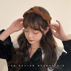 韓国の東大門の純色のスエードの蝶結びの細いカチューシャの女性の百合は外出して髪を抑えて滑り止めの髪飾りの頭飾りをします。