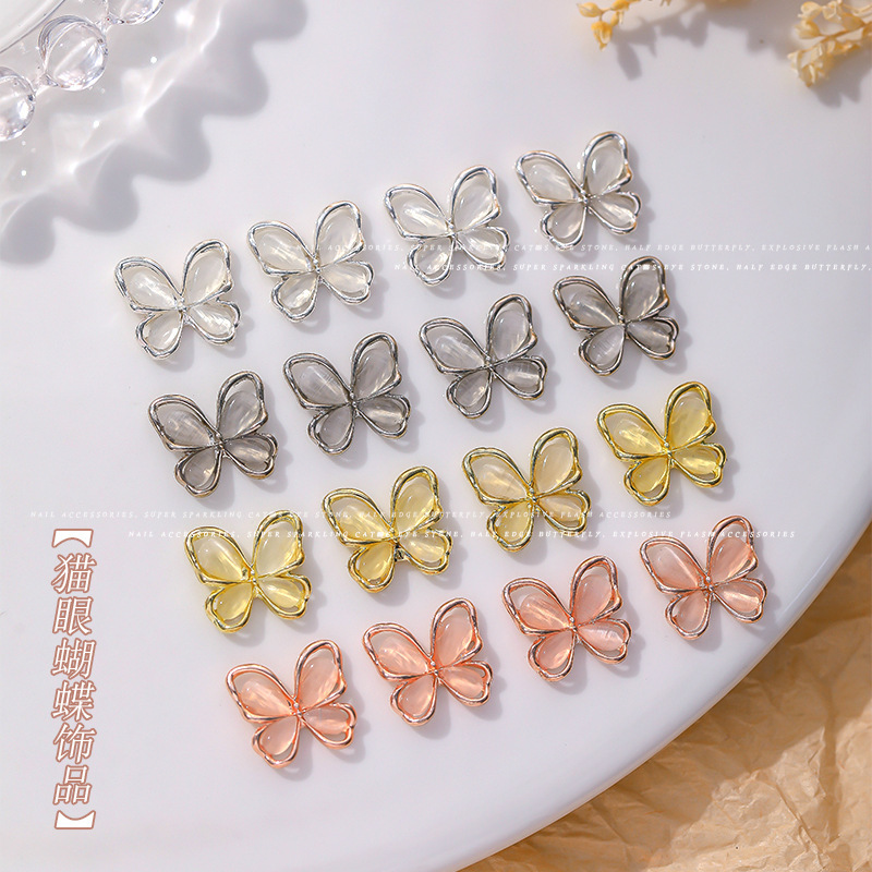 Nueva joyería de diamantes de uñas estilo caliente ojo de gato mariposa tridimensional súper flash ligero lujo hueco rojo de la red portátil armadura accesorios de diamantes grandes