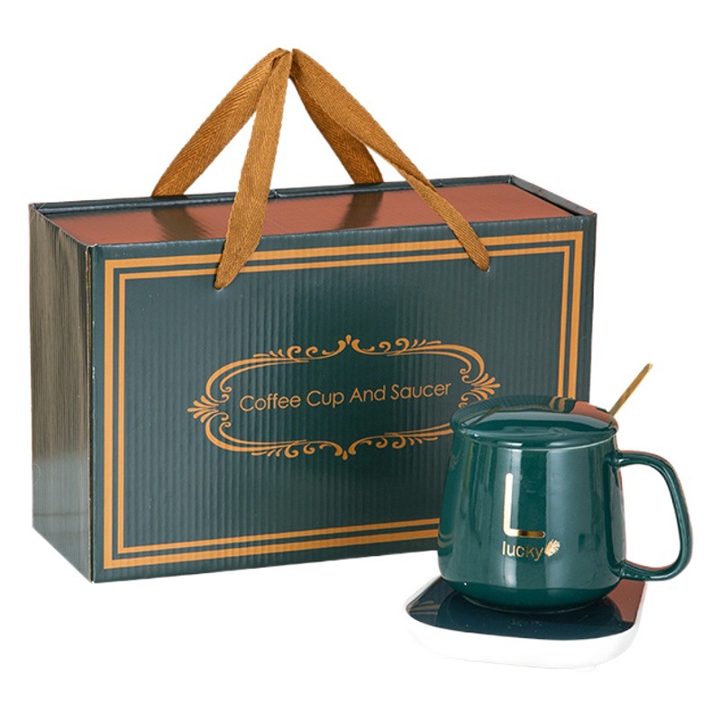 Taza caliente 55 grados taza de temperatura constante conjunto simple taza de calefacción taza de agua de cerámica regalo del hogar ventosa al por mayor