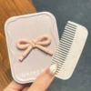 Fuchsia three dimensional brush with bow
