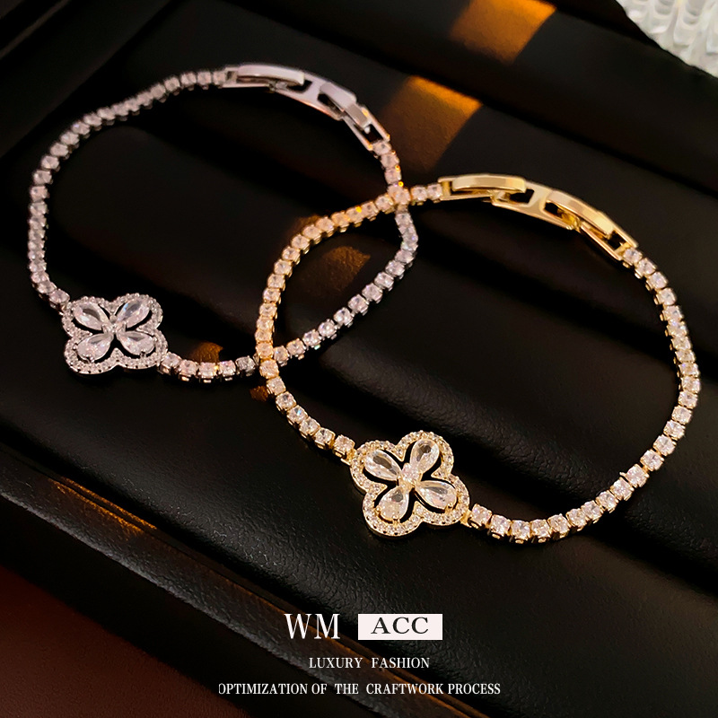 Oro real electrochapado ZIRCON flor hebilla pulsera moda todo-fósforo pulsera luz lujo alto sentido pulsera para las mujeres al por mayor