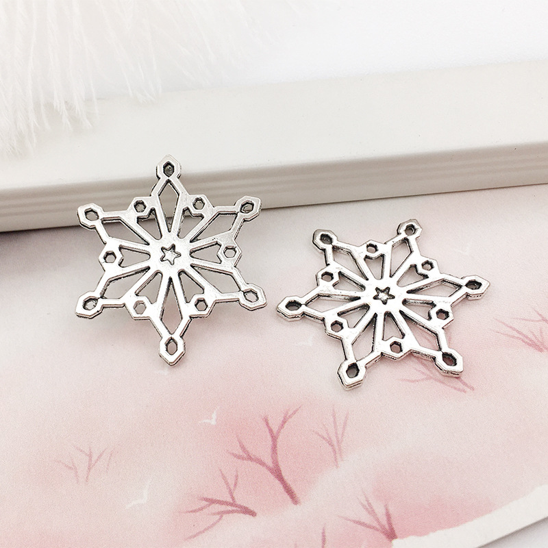 1 copo de nieve aleación colgante DIY aleación joyería brillante plata hueco copo de nieve colgante transfronterizo Amazon Venta caliente