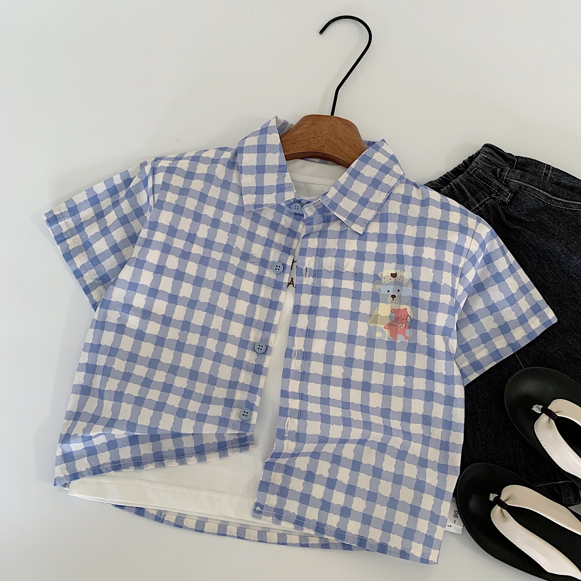 Camisa de manga corta para niños Maibao 2025 verano nuevo estilo coreano para niños y niñas camisa de algodón de dibujos animados a cuadros