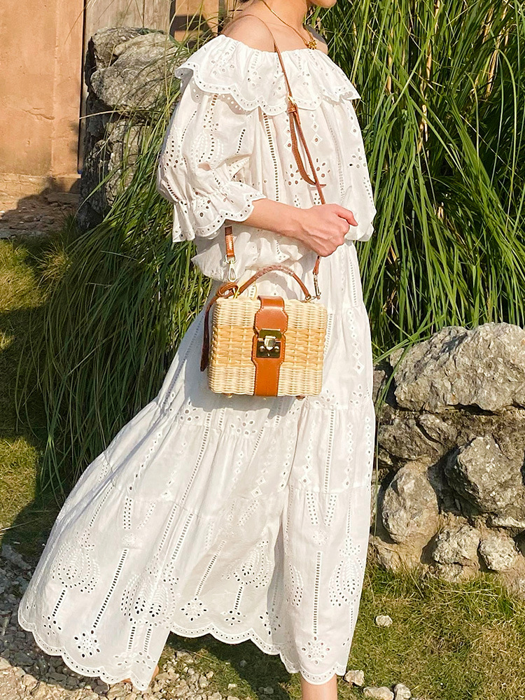 春夏の新型リゾート風フランスの肩の小さい上着の白い半身のスカートの女性の名媛の気質の小さい香風のスーツ