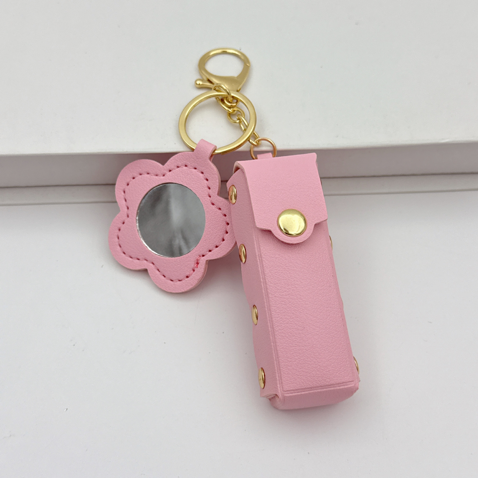 Flor espejo llavero cuero transfronterizo regalo colgante joyería creativo mini lápiz labial almacenamiento llavero colgante