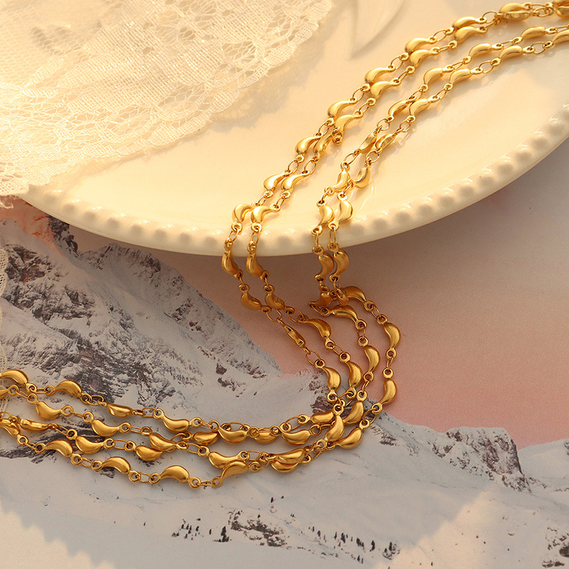 Conjunto de joyería transfronteriza chapada en oro, pequeño animal fresco y dulce europeo y americano, colgante de delfín, collar, material de acero de titanio