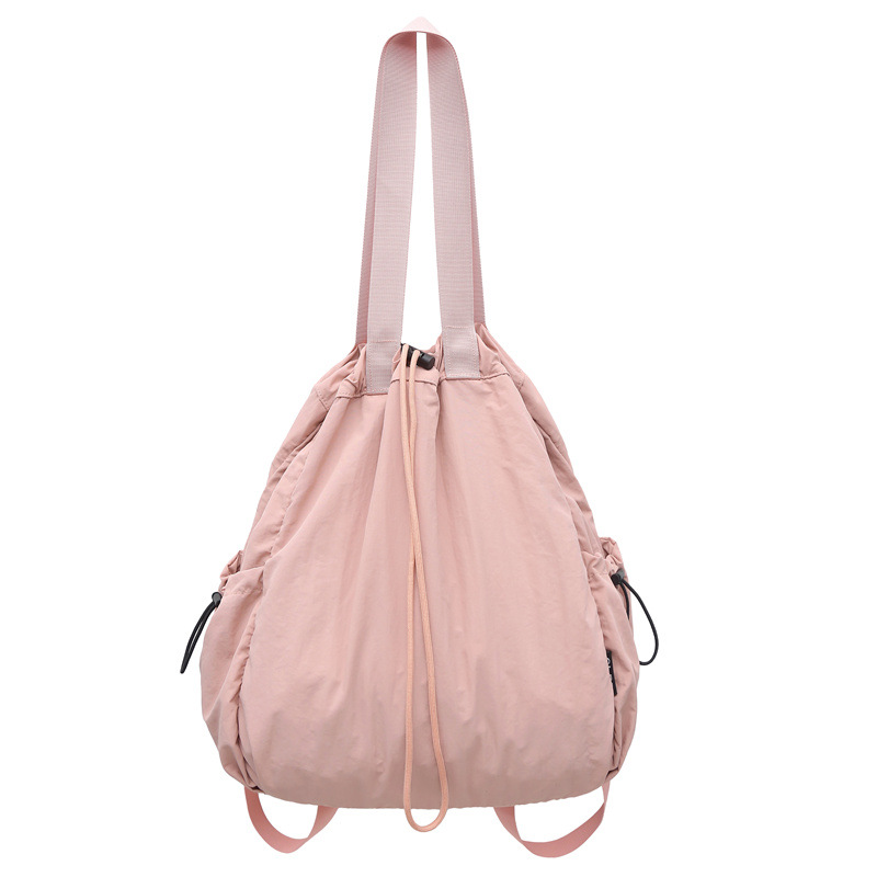 Mochila de nailon con cordón para mujer 2024 nuevo bolso de cubo de doble uso de un solo hombro literario simple para estudiantes universitarios