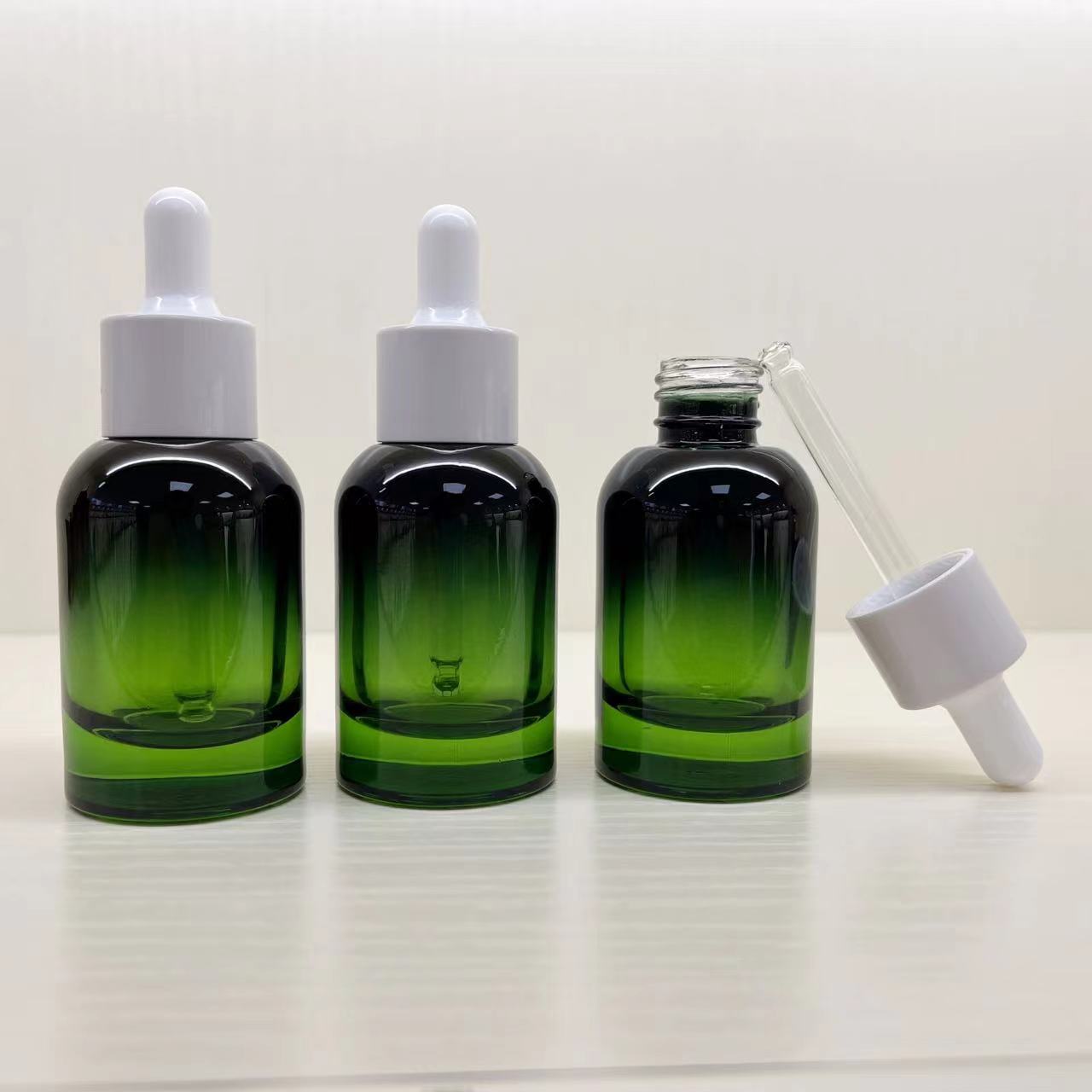 Esencia de fábrica sub-botella 30ml bomba de gota de presión prismática botella de aceite esencial botella cuentagotas bomba de gota giratoria botella de vidrio