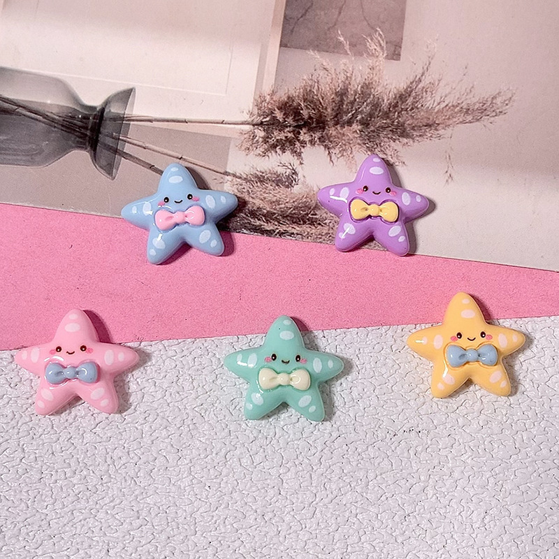 Cartoon brillante corbata estrella de mar material DIY accesorios de resina pegamento crema caja de teléfono móvil material clip de pelo parche de taza de agua
