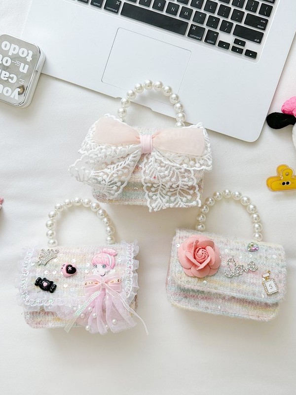 Primavera y verano nuevos bolsos infantiles, bolsos de perlas de arco, bolsos de mano, princesa de estilo extranjero, bolsos de cambio de hombro