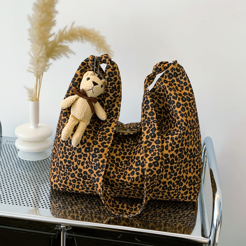 Estudiantes universitarios clase de viaje bolsa de gran capacidad para mujeres 2024 nueva moda extranjera leopardo tela mochila