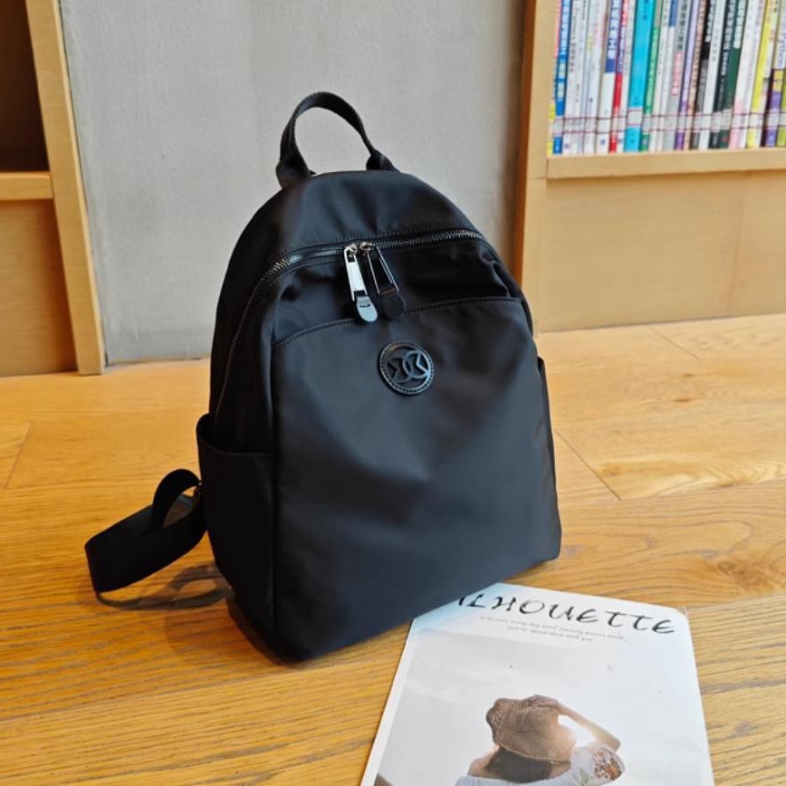 Mochila turística mujer 2024 nueva moda nicho de alta gama ligera bolsa de cercanías mochila de viaje bolsa de mamá