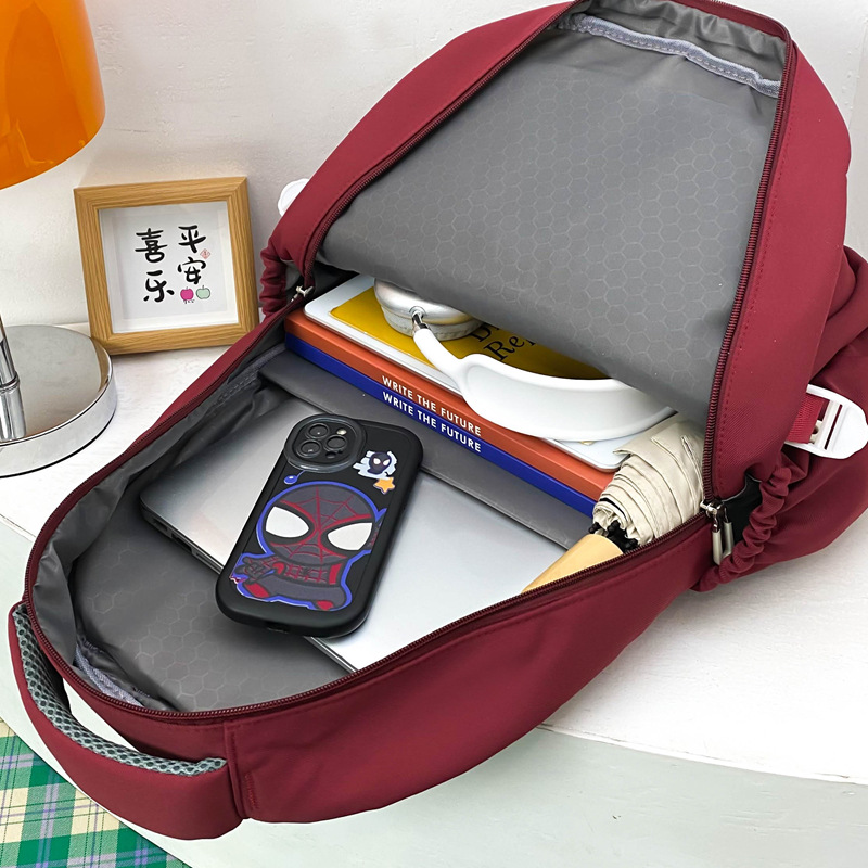 Al por mayor 2025 nuevos estudiantes de primaria de secundaria masculinos mochila de escolares de escolares de alta niñas mochila de viaje de gran capacidad