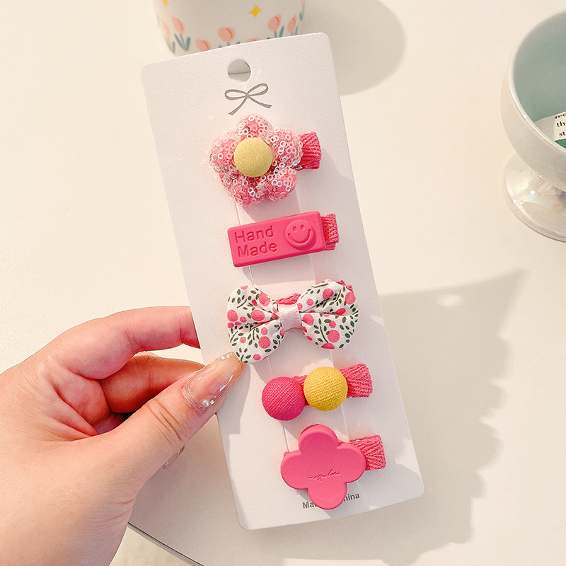 Hermosos clips de cabello de color para niños coreanos de alto nivel sensación de arco de niñas bolsa de tela no daña clips de cabello de bebé