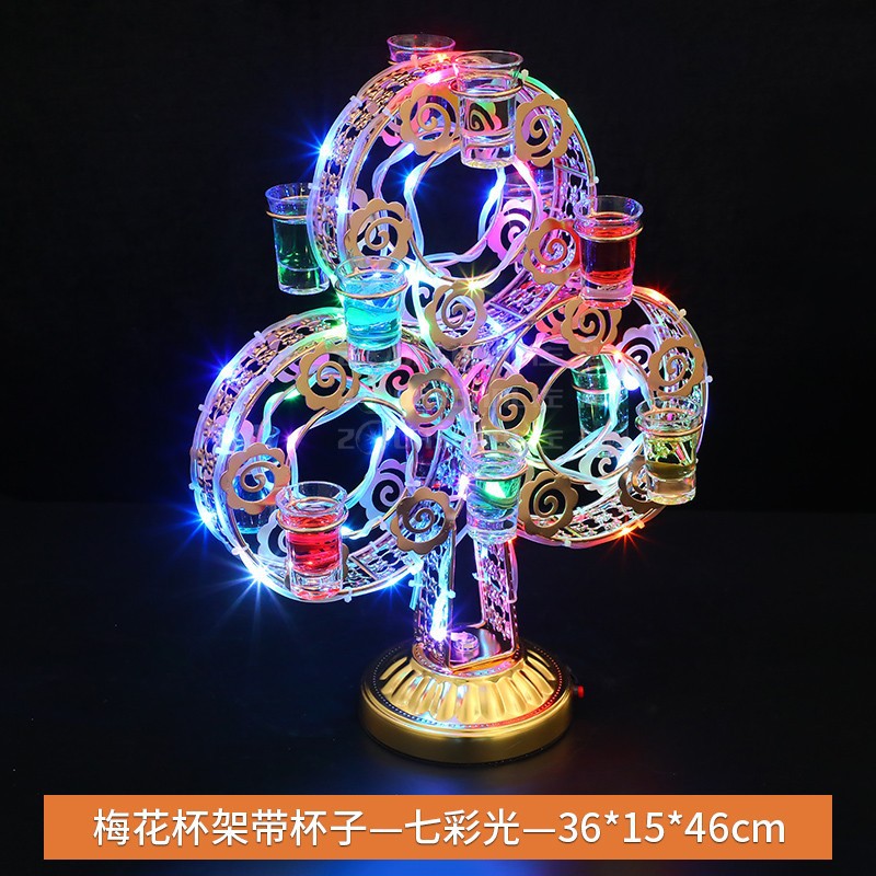 Portavasos de flor de ciruelo con luz colorida de taza