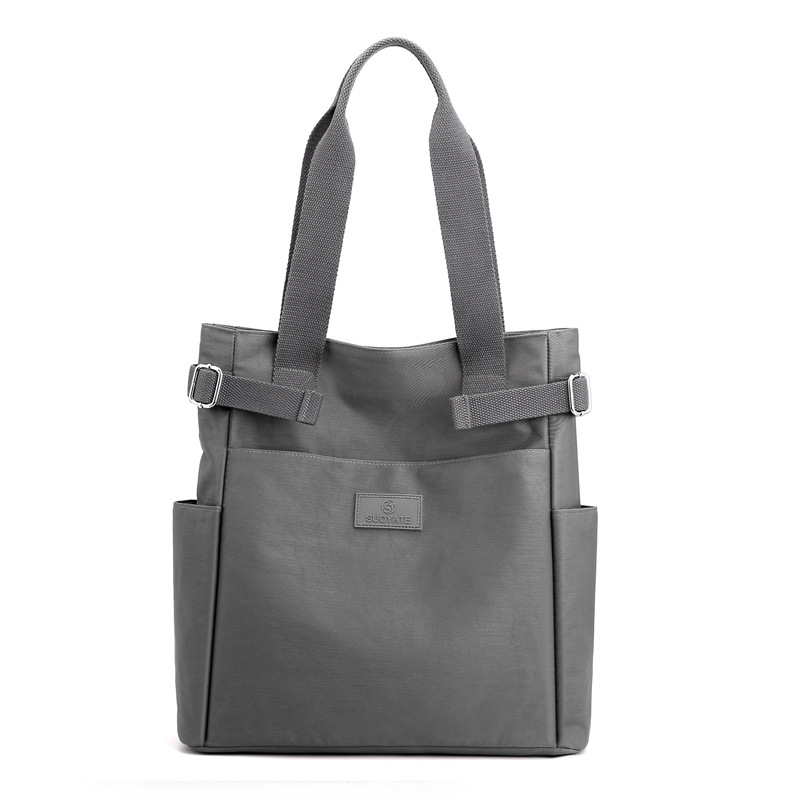 Nuevo bolso de hombro versátil de nailon para mujer, bolso de tela informal a la moda, bolso de lona para mujer, bolso de mano con gran capacidad
