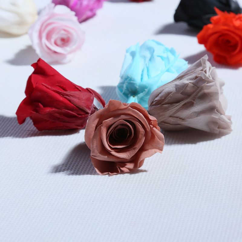 Venta directa de fábrica de Yunnan cabeza de rosa eterna 2-3 cm B grado 21 flores Día de San Valentín materiales diy hechos a mano al por mayor