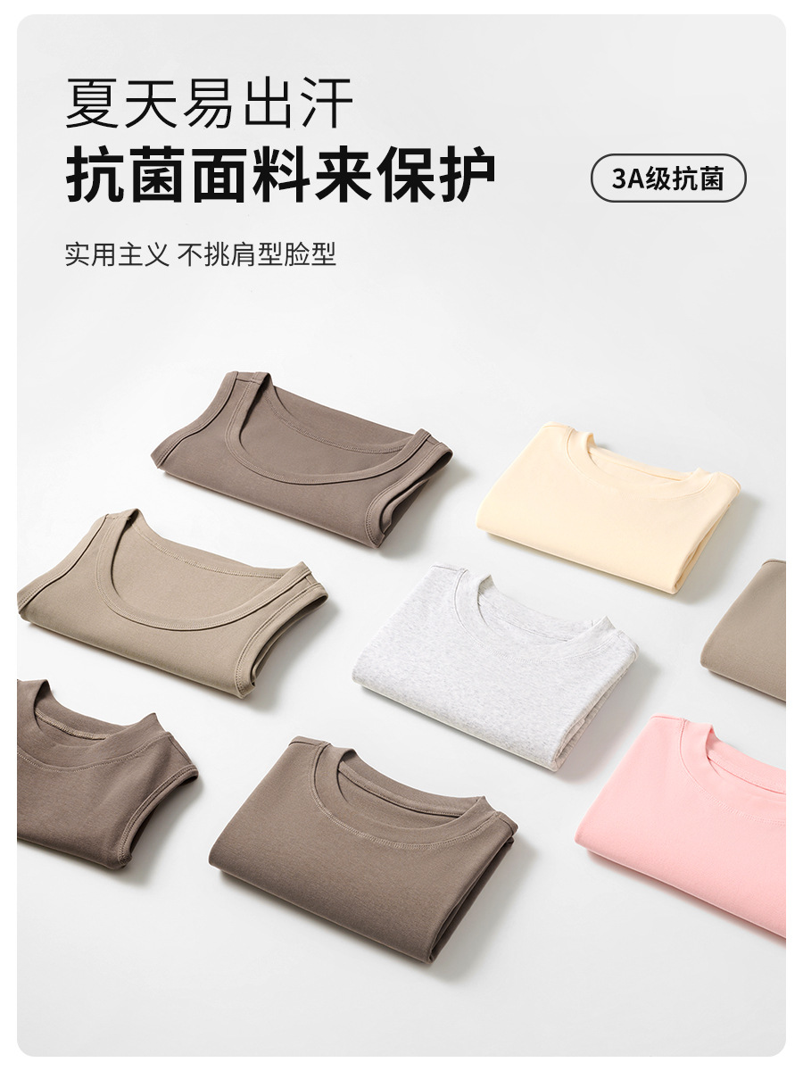 肩の半袖のtシャツの女性のフランスの丸首の2025夏の短いタイプの弾力の修身のギャルの風はやせている短い上着の女性を現します。