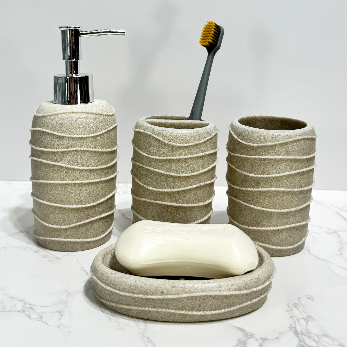 Juego de cuatro piezas de arena y grava