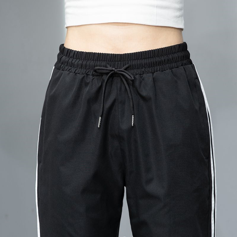 2023 Pantalones deportivos de primavera y otoño pantalones largos casuales para hombres y mujeres Comercio exterior Pareja juvenil suelta slim fit pantalones de chándal atados al tobillo