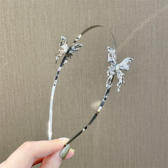 European and American-style metallic liquid-embedded diamond butterfly hairband for women—unique design, premium silver-toned headband, wholesale available.