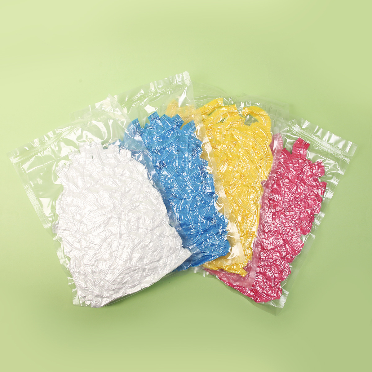 Fábrica al por mayor extra grande engrosada gorro de ducha vacío 100 un paquete de tapa de tira belleza y peluquería gorro de ducha desechable