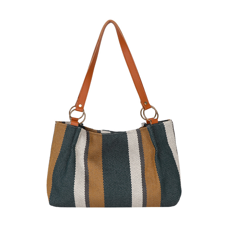 Otoño de este año popular banda de gran capacidad versátil bolsa de lona casual 2025 nueva bolsa de hombro de viaje para mujeres